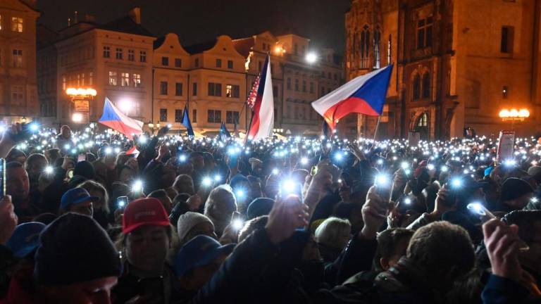 Supporters of Presidential candidate in Czech presidential election 2023 and Former Chief of the General Staff of the Army of the Czech Republic Petr Pavel light hundreds of smartphones as they attend his election campaign rally on the Old Town Square on January 25, 2023 in Prague. AFPPIX
