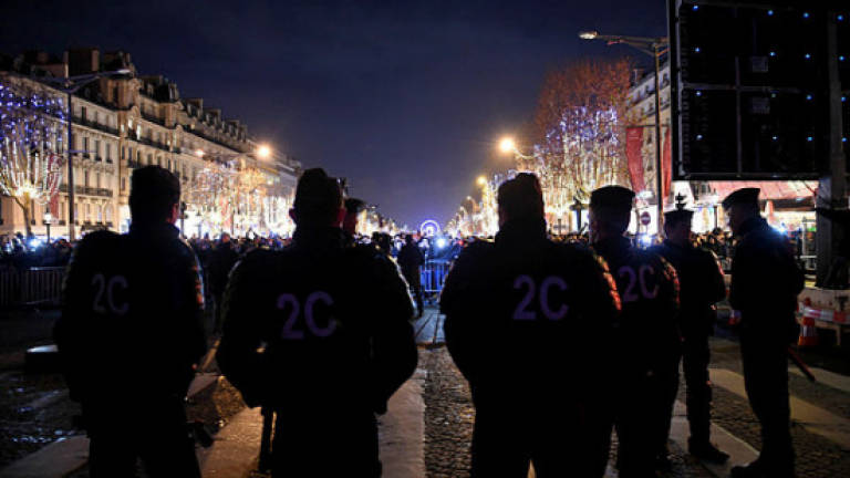 France vows crackdown after New Year attack on police
