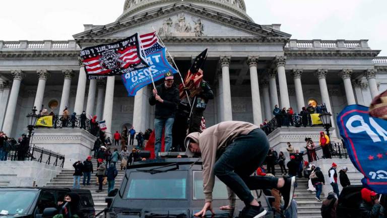 (FILES) In this file photo taken on January 06, 2021, supporters of US President Donald Trump protest outside the US Capitol in Washington, DC. AFPPIX