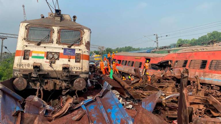 Damaged carriages are seen at the accident site of a three-train collision near Balasore, about 200 km (125 miles) from the state capital Bhubaneswar, on June 3, 2023. AFPPIX