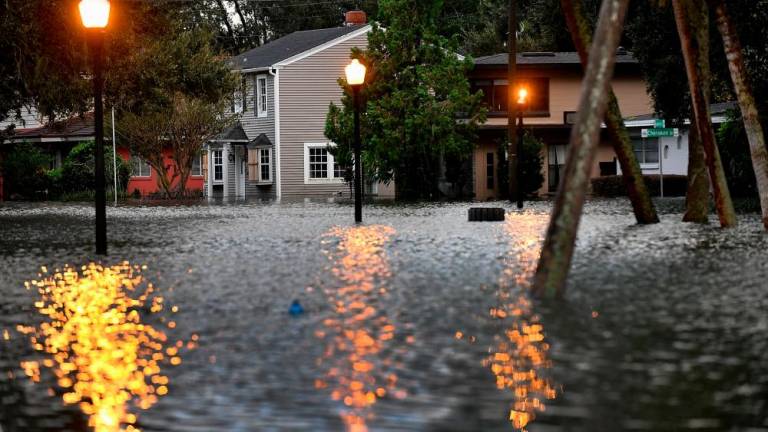ORLANDO, FLORIDA - SEPTEMBER 29: A neighborhood remains flooded after Hurricane Ian on September 29, 2022 in Orlando, Florida. AFPPIX