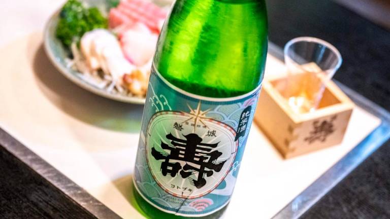 This picture taken on August 31, 2023 shows a bottle of sake from Daisuke Suzuki's brewery at a restaurant in Namie, Fukushima Prefecture. AFPPIX