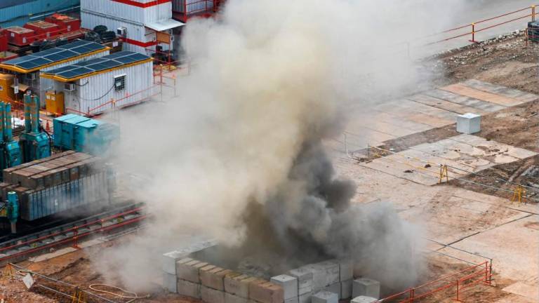 Smoke rises after a 100kg World War II-era aerial bomb is detonated at a construction site in Singapore on September 26, 2023. AFPPIX