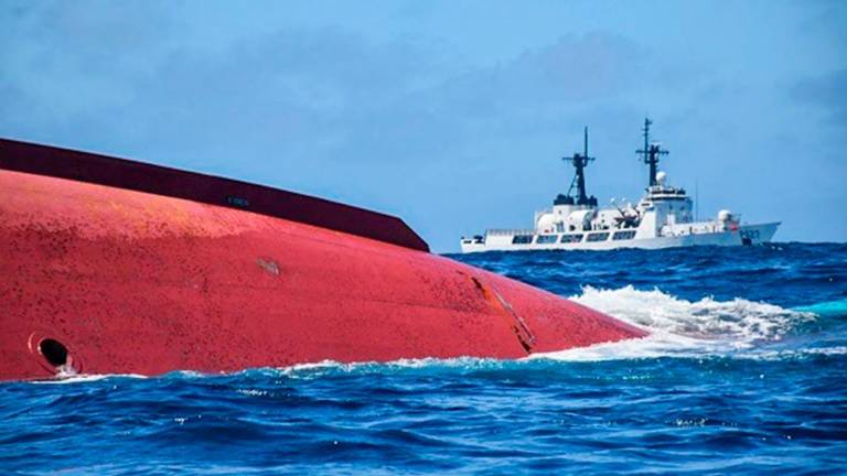 This handout photo taken by the Sri Lankan Navy on May 23 and released on May 24, 2023, shows a capsized Chinese fishing vessel (Lu Peng Yuan Yu 028) in the Indian Ocean. Sri Lanka’s navy said on May 24 it had located 14 bodies inside a Chinese fishing boat that had capsized last week with 39 crew on board. AFPPIX