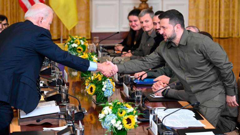 US President Joe Biden and Ukrainian President Volodymyr Zelensky shake hands during an expanded bilateral meeting in the East Room of the White House in Washington, DC, on September 21, 2023. AFPPIX
