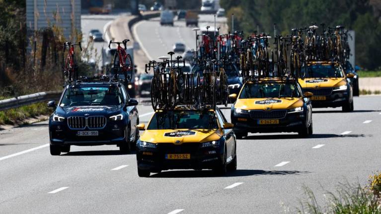 Team Jumbo-Visma’s crew cars (R) drive on a highway and carry the team’s bicycles after the 6th stage of the 81st Paris - Nice cycling race was canceled due to heavy winds, near Tourves, south-eastern France, on March 10, 2023. AFPPIX