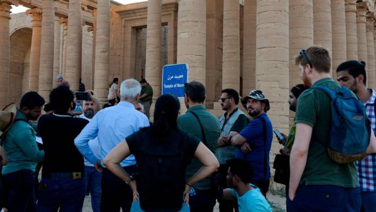 A group of tourists visit the ancient city of Hatra in northern Iraq on September 10, 2022, as local authority initiatives seek to encourage tourism and turn the page on the years of violence by the Islamic State IS group. AFPPIX