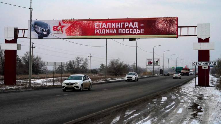 A road sign reading “Stalingrad” sits on the side of a road entering the Russian southern city of Volgograd (former Stalingrad) on January 31, 2023, after authorities temporarily replaced signs as part of celebrations marking the 80th anniversary of the Stalingrad Battle. AFPPIX