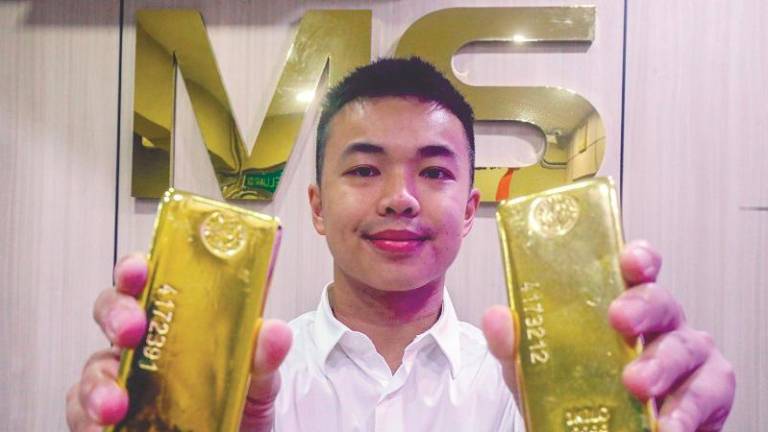 Leong displaying some of MS Jewels’ gold products.