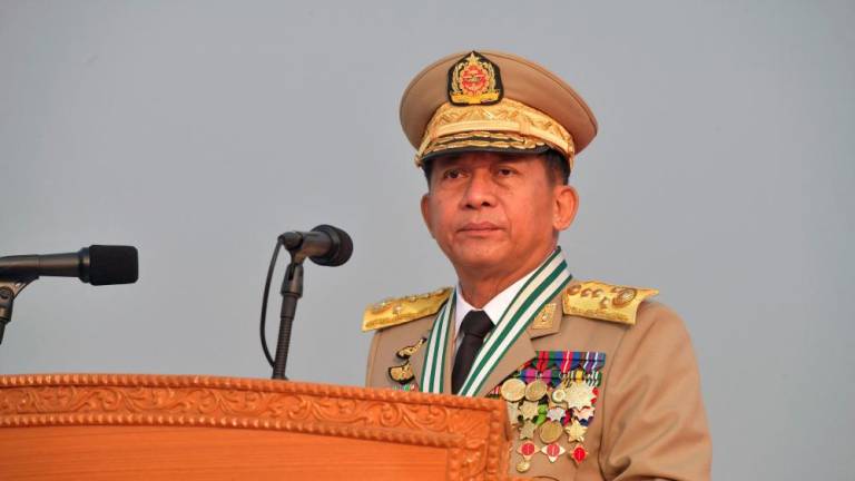 This handout photo taken and released on March 27, 2022 by the Myanmar Military Information Team shows Chief Senior General Min Aung Hlaing attending a ceremony to mark the country's 77th Armed Forces Day in Naypyidaw. -AFPPIX