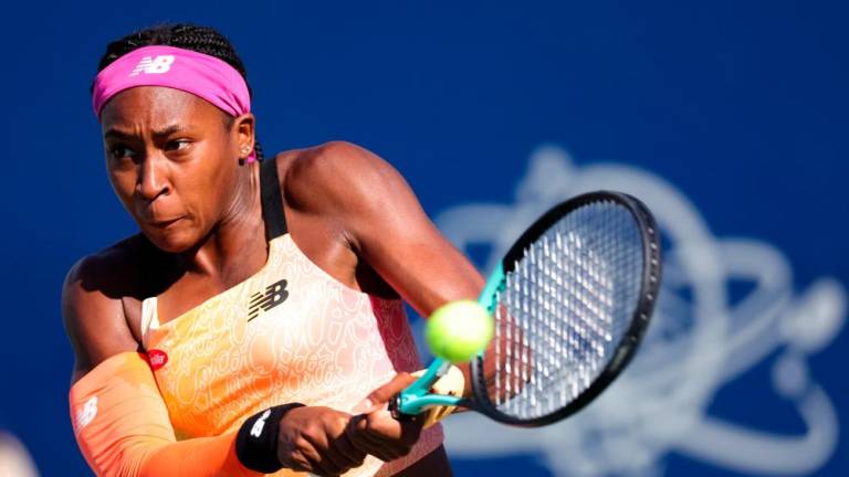 (FILES) In this file photo taken on August 5, 2022, Coco Gauff returns a shot from Paula Badosa, of Spain, during the Mubadala Silicon Valley Classic, part of the Hologic WTA Tour, at Spartan Tennis Complex in San Jose, California. AFPPIX