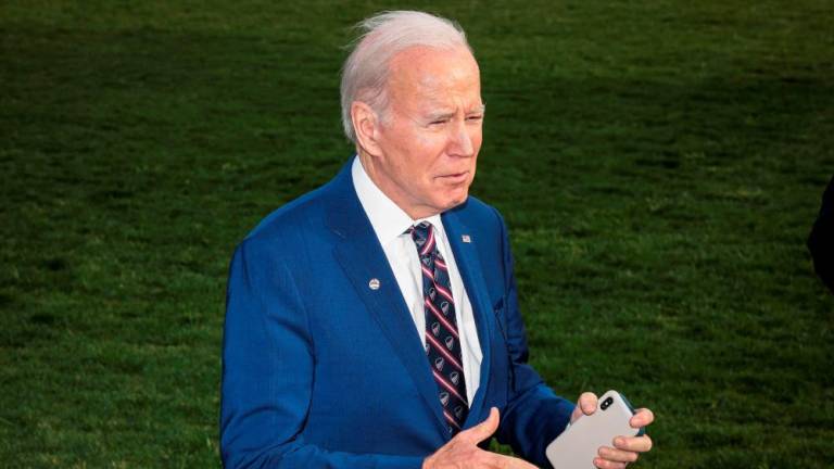 US President Joe Biden talks to the press on the South Lawn of the White House as he arrives on March 28, 2023 in Washington, DC, from a trip to Durham, North Carolina. Biden traveled to Durham to begin his “Investing in America” tour/AFPPix