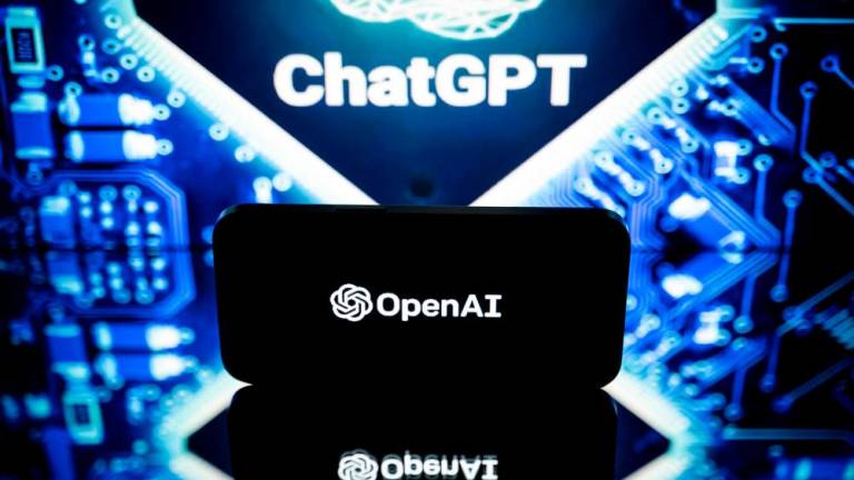 This file photo taken on January 23, 2023 in Toulouse, southwestern France, shows screens displaying the logos of OpenAI and ChatGPT. AFPPIX