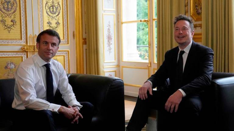 SpaceX, Twitter and electric car maker Tesla CEO Elon Musk meets with France’s President Emmanuel Macron (L) at the Elysee presidential palace in Paris on May 15, 2023. AFPPIX