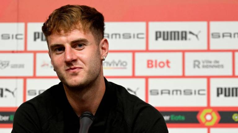 (FILES) In this file photo taken on August 3, 2022 Stade Rennais's newly recruited defender Wales' Joe Rodon gives a press conference during his presentation at the Roazhon Park stadium in Rennes, north-western France. - AFPPIX