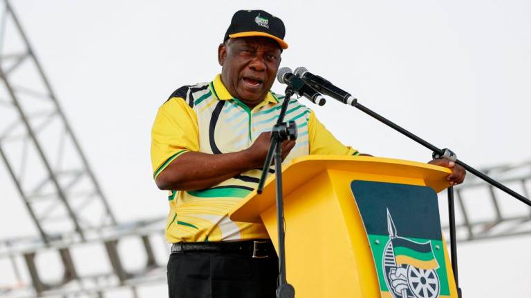 The governing African National Congress (ANC) President Cyril Ramaphosa addresses supporters during their party’s 2019 Manifesto Review Rally at the Dobsonville Stadium in Soweto on September 3, 2023. AFPPIX