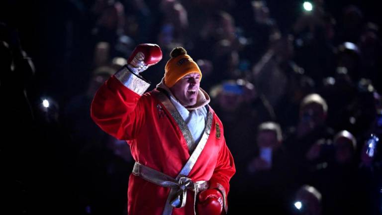 Britain’s Tyson Fury arrives to fight against Britain’s Derek Chisora during their WBC heavyweight title boxing match, at the Tottenham Hotspur stadium in east London, on December 3, 2022/AFPPix