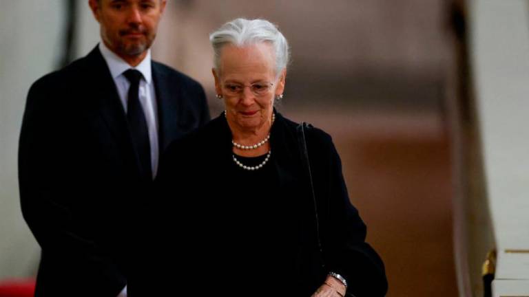 Denmark’s Queen Margrethe pays her respects to Britain’s Queen Elizabeth, following her death, during her lying-in-state at Westminster Hall, in London, Britain, September 18, 2022. REUTERSPIX