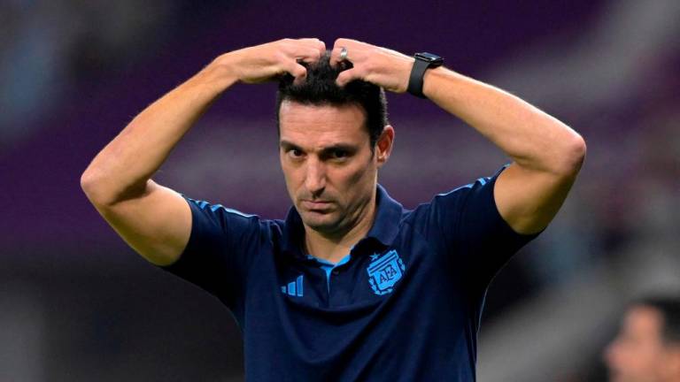 Argentina’s coach #00 Lionel Scaloni reacts during the Qatar 2022 World Cup round of 16 football match between Argentina and Australia at the Ahmad Bin Ali Stadium in Al-Rayyan, west of Doha on December 3, 2022/AFPPix