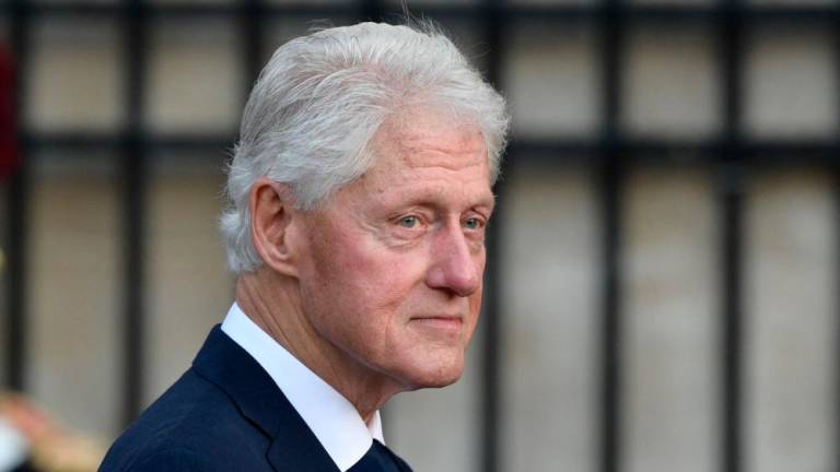 In this file photo taken on September 30, 2019, former US President Bill Clinton arrives to attend a church service for former French President Jacques Chirac at the Saint-Sulpice church in Paris, Fance/AFPPix