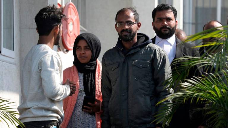 Journalist Siddique Kappan (2R), who was arrested in October 2020 in the northern state of Uttar Pradesh where he had travelled to report on a high-profile gang rape case, walks out from Lucknow District jail after being granted bail in a money laundering case, in Lucknow on February 2, 2023. AFPPIX
