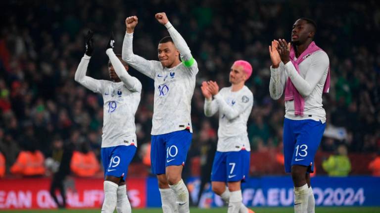 Kylian Mbappe (2L), Moussa Diaby (L), Antoine Griezmann (2R) and Ibrahima Konate (R) applaud fans on the final whistle in the UEFA Euro 2024 group B qualification football match between Republic of Ireland and France at Aviva Stadium in Dublin, Ireland on March 27, 2023. AFPPIX
