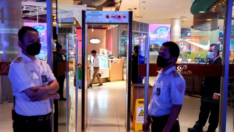 Security guard prepare a check point inside of the luxury Siam Paragon shopping mall after Thai police arrested a teenage gunman who is suspected of killing foreigners and wounding other people in a shooting spree, in Bangkok, Thailand, October 4, 2023. REUTERSPIX