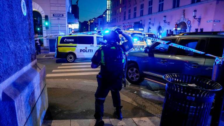 Police secure the area after a shooting in Oslo on June 25, 2022. Two people were killed and several others seriously wounded in a shooting in central Oslo, Norwegian police said on June 25. - AFPPIX
