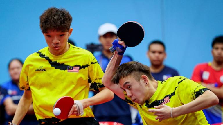 PHNOM PENH, June 6 -- The Malaysian contingent successfully achieved its target of 33 Gold medals through the Chee Chaoming-Brady Chin pairing in the Men’s Ping Pong Class 9 doubles event at the Table Tennis Hall, Morodok Techo Stadium, last night. BERNAMAPIX
