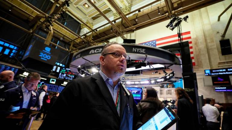 Traders working on the floor of the New York Stock Exchange on Monday, March 27, 2023. – Reuterspic