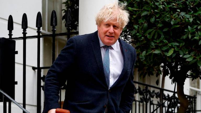Former British Prime Minister Boris Johnson leaves his home, in London, Britain March 21, 2023/REUTERSPix