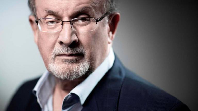 (FILES) In this file photo taken on September 10, 2018, British novelist and essayist Salman Rushdie poses during a photo session in Paris. AFPPIX