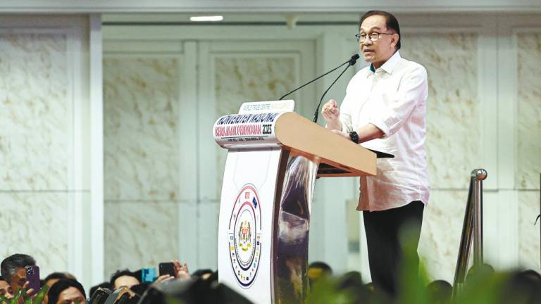 Anwar delivering his address at the Unity Government National Convention 2023 today. – Bernamapic