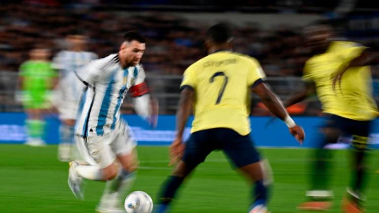 Lionel Messi (L) is marked by Pervis Estupinan (C) and Ecuador’s midfielder Moises Caicedo during the 2026 FIFA World Cup South American qualifiers football match between Argentina and Ecuador, at the Mas Monumental stadium in Buenos Aires, on September 7, 2023. AFPPIX