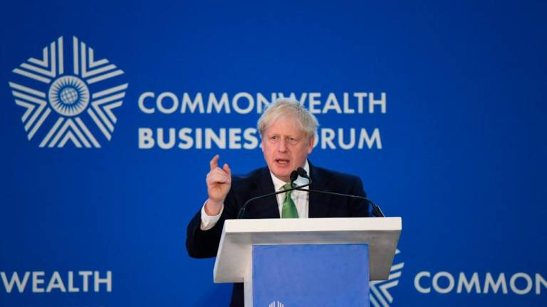 Britain’s Prime Minister Boris Johnson addresses a conference on “Achieving a greener future” in Kigali, Rwanda, on June 23, 2022 during the Commonwealth Heads of Government Meeting (CHOGM). AFPPIX