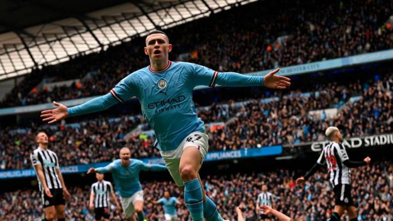 Manchester City’s English midfielder Phil Foden celebrates after scoring the opening goal of the English Premier League football match between Manchester City and Newcastle United at the Etihad Stadium in Manchester, north west England, on March 4, 2023. AFPPIX