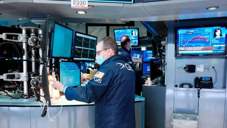 Traders working on the floor of the New York Stock Exchange. In December, the SEC mandated that Chinese companies listed on US stock exchanges must disclose whether they are owned or controlled by a government entity, and provide evidence of their auditing inspections. – AFPpix