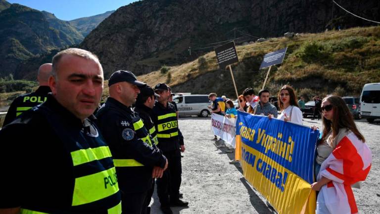 Georgian activists protest against mass immigration from Russia at the Kazbegi / Verkhniy Lars border crossing point between the two countries on September 28, 2022. AFPPIX