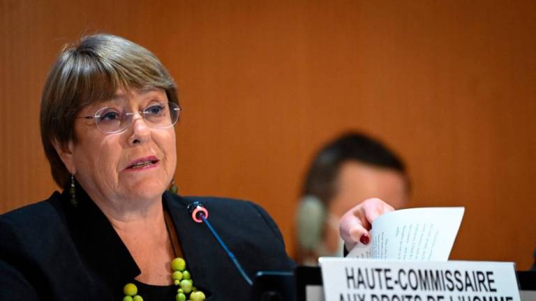 (FILES) In this file photo taken on February 28, 2022 United Nations High Commissioner for Human Rights Michelle Bachelet delivers a speech at the opening of a session of the UN Human Rights Council in Geneva. AFPPIX