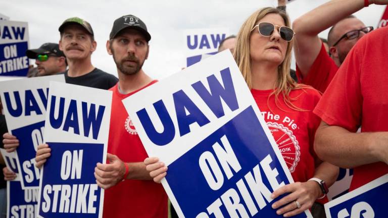 LANSING, MICHIGAN - SEPTEMBER 29: United Auto Workers members strike the General Motors Lansing Delta Assembly Plant on September 29, 2023 in Lansing, Michigan. AFPPIX