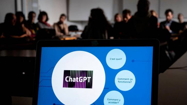 Teachers are seen behind a laptop during a workshop on ChatGpt bot organised for by the School Media Service (SEM) of the Public education of the Swiss canton of Geneva, on February 1, 2023. AFPPIX