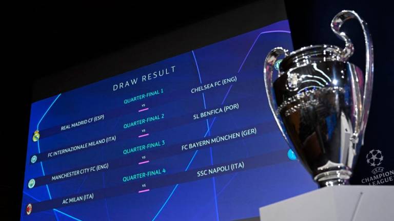 This photograph shows the draw result for the quarter-final and the trophy of the 2022-2023 UEFA Champions League football tournament, in Nyon, on March 17, 2023. AFPPIX