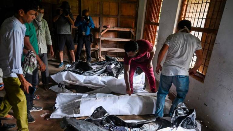 Bodies are seen at a high school used as temporary mortuary to identify the dead recovered from the carriage wreckage of a three-train collision near Balasore, in India’s eastern state of Odisha, on June 4, 2023/AFPPix