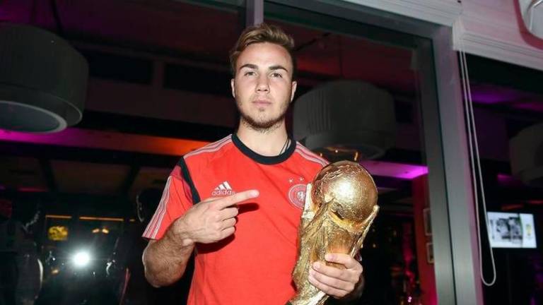 Germany’s Mario Goetze poses with the World Cup trophy during the DFB-WM gala party at the Sheraton hotel in Rio de Janeiro July 13, 2014. REUTERSPIX