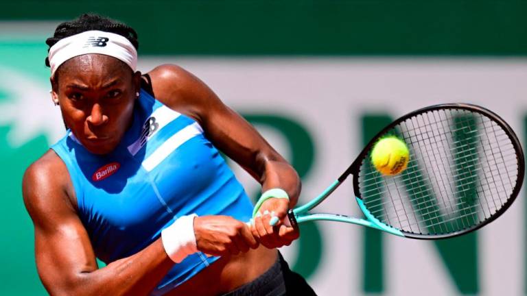 US Coco Gauff plays a backhand return to Russia’s Mirra Andreeva during their women’s singles match on day seven of the Roland-Garros Open tennis tournament at the Court Suzanne-Lenglen in Paris on June 3, 2023/AFPPix