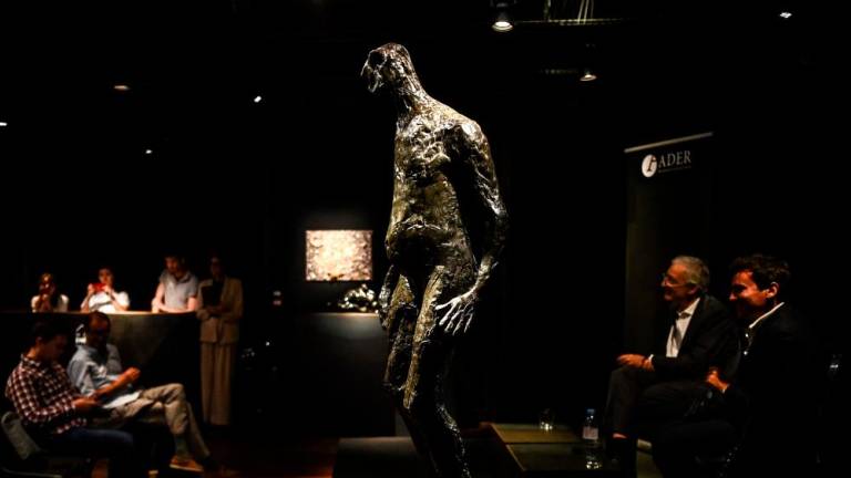 People attend the presentation of artworks belonging to French actor Gerard Depardieu, including ‘L’homme qui marche’ (The walking man) bronze statue by Germaine Richier (C), ahead of their September auction sale, at Drouot auction house in Paris on June 15, 2023/AFPpix