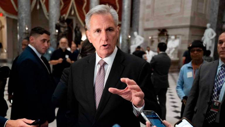 US House Speaker Kevin McCarthy (R-CA) speaks to members of the media in Statuary Hall at the US Capitol in Washington, DC, on October 2, 2023/AFPPix