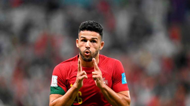 Portugal’s forward #26 Goncalo Ramos celebrates scoring his team’s first goal during the Qatar 2022 World Cup round of 16 football match between Portugal and Switzerland at Lusail Stadium in Lusail, north of Doha on December 6, 2022. AFPPIX