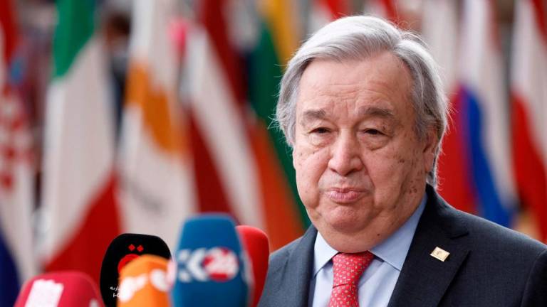 U.N. Secretary-General António Guterres (L) speaks on arrival for a EU Summit, at the EU headquarters in Brussels, on March 23, 2023. AFPPIX