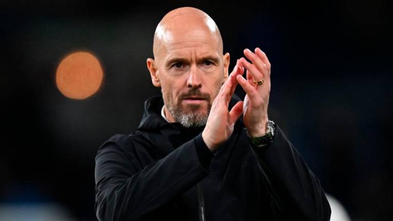Manchester United's Dutch manager Erik ten Hag applauds fans on the pitch after the English Premier League football match between Burnley and Manchester United at Turf Moor in Burnley, north-west England on September 23, 2023. - AFPPIX